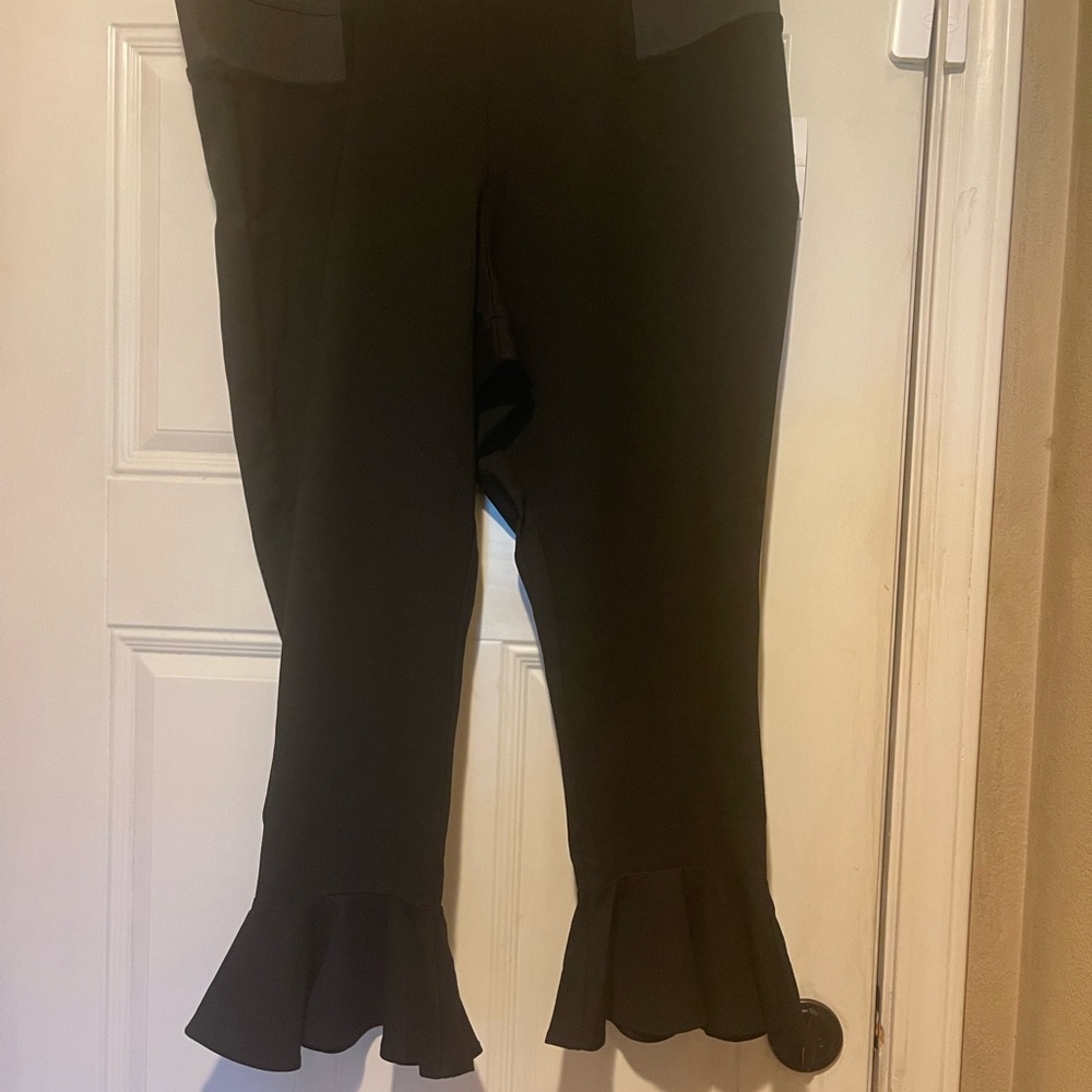 Cute black crops with a fun detail on the bottom.Brand new with tags